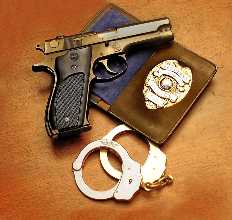 police officer badge and gun