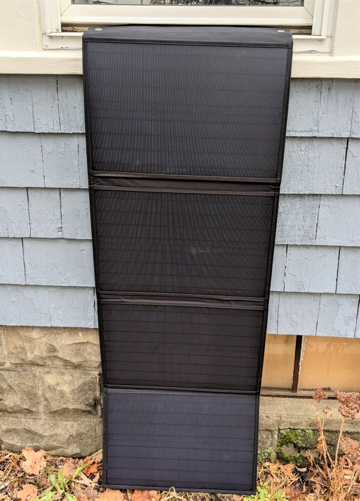 solar panels hanging from house window