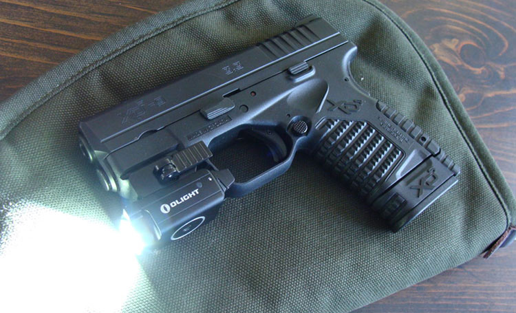 small pistol weapon light mounted on XD