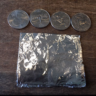 4 quarters and aluminum foil