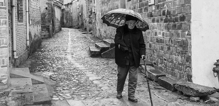 old man with cane weapon