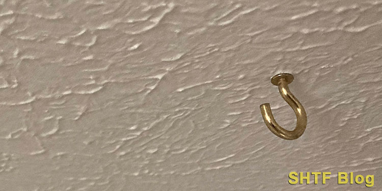 screw the ‘J’ hook to ceiling