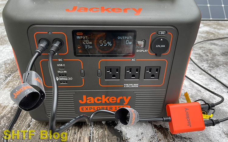 Jackery Explorer 1500 charging on gray day with solar panels