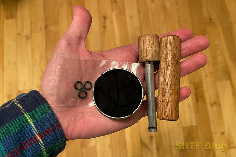 fire piston pieces in hand