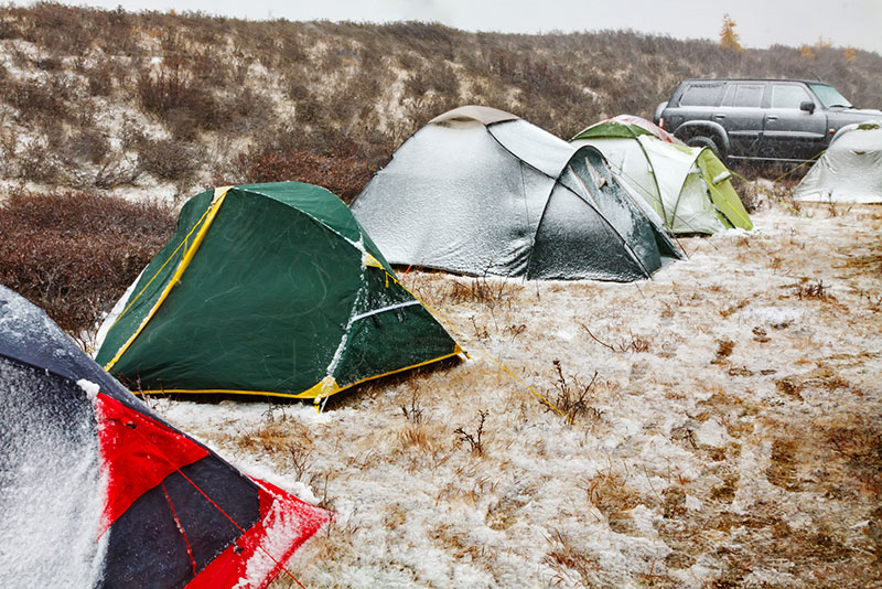 tents lined up in snowy conditions